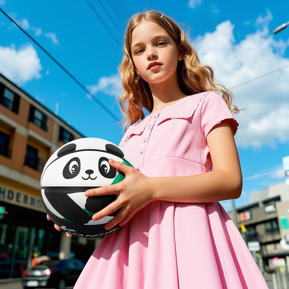 A white child is holding Kuangmi Panda Basketball