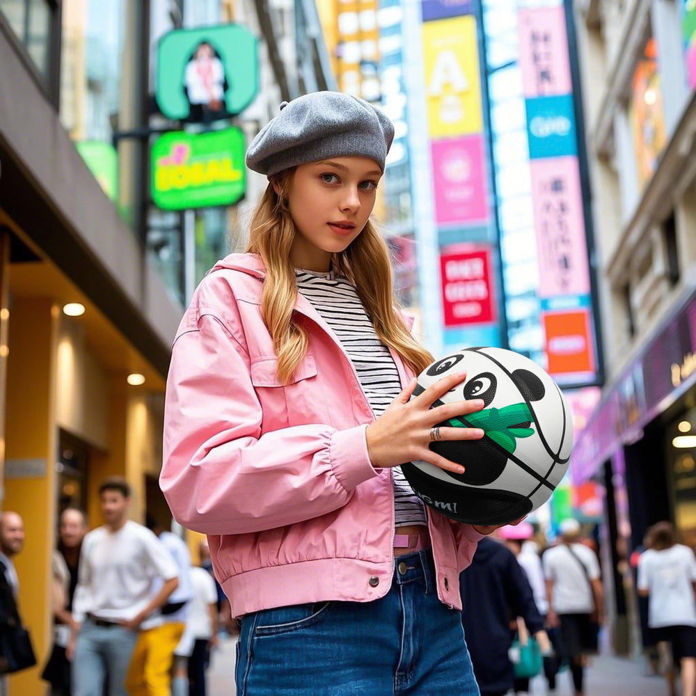 A girl is holding Kuangmi Panda Basketball